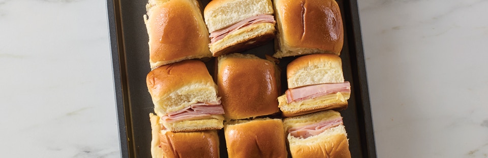 baking tray of ham sliders