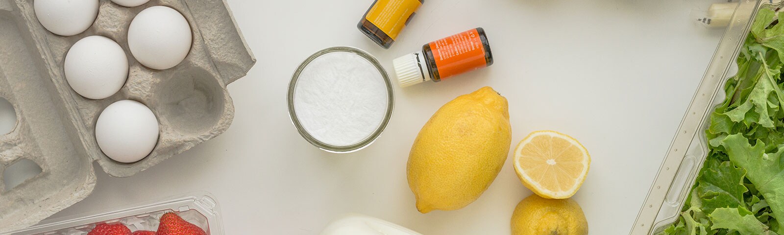 Countertop with a carton of eggs, essential oils and lemons